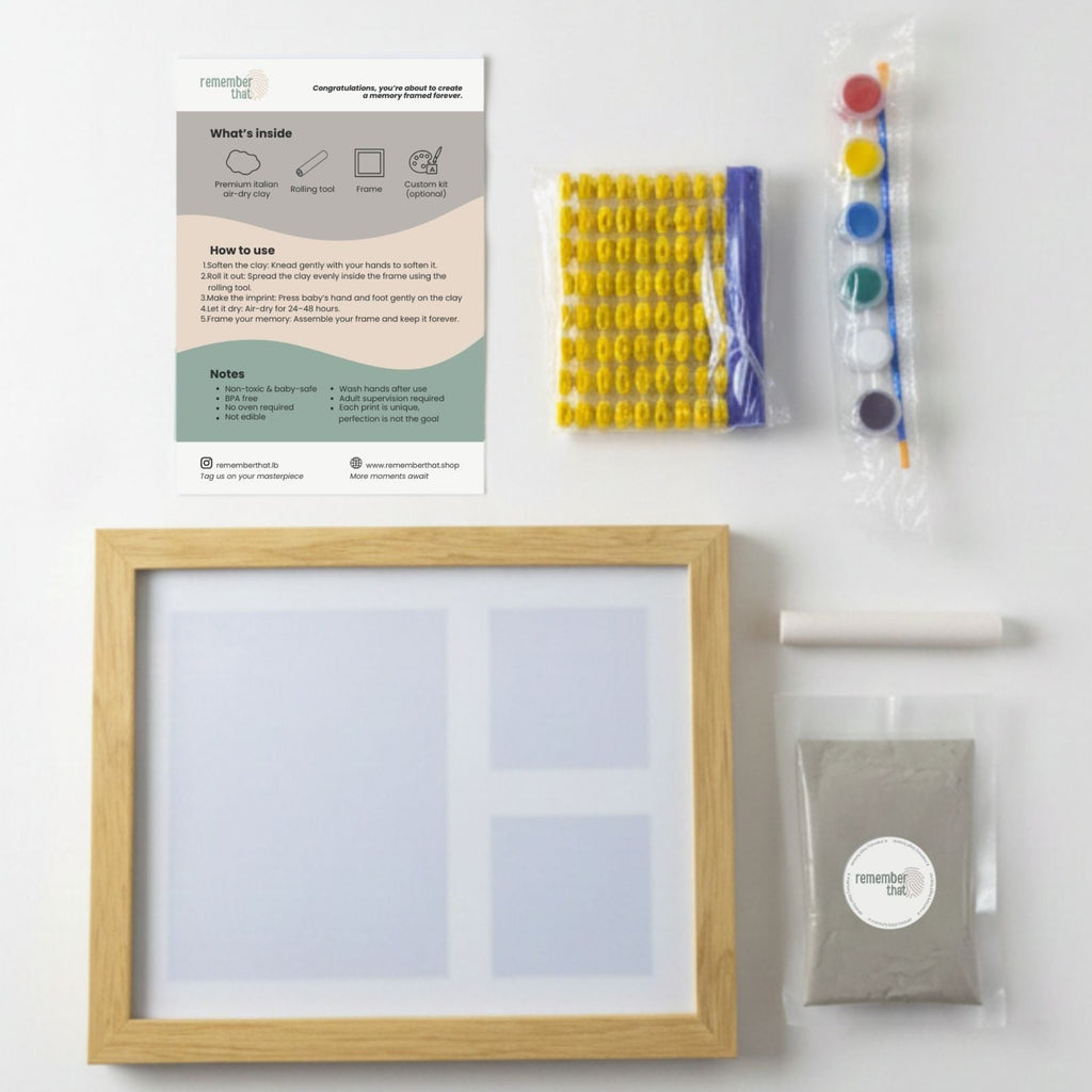 baby handprint and footprint clay kit contents including Italian clay, paint, roller, letters and frame