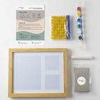 baby handprint and footprint clay kit contents including Italian clay, paint, roller, letters and frame