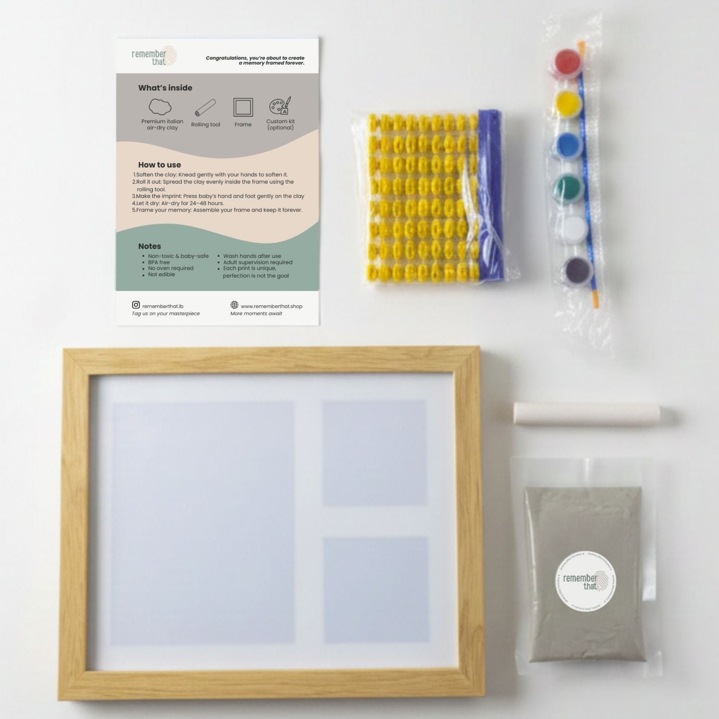 baby handprint and footprint clay kit contents including Italian clay, paint, roller, letters and frame